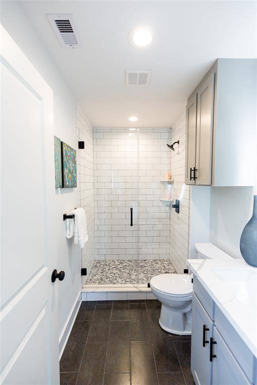 En suite bathroom located with the East side bedroom that is in the front.