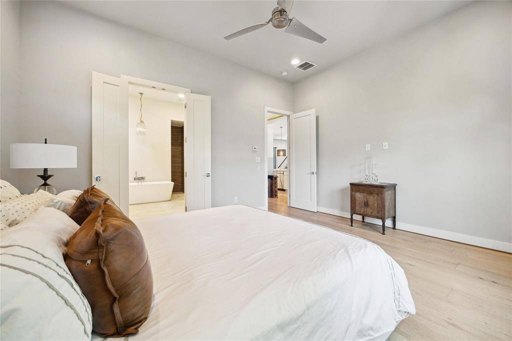 The primary bedroom has large windows grace the room,allowing natural light in and an en-suite bathroom!