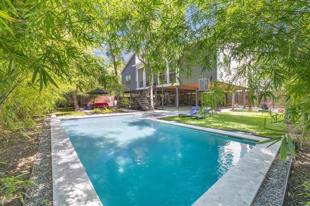 Step into the backyard oasis, with alarge covered patio and relaxing pool, creating aninviting outdoor retreat.
