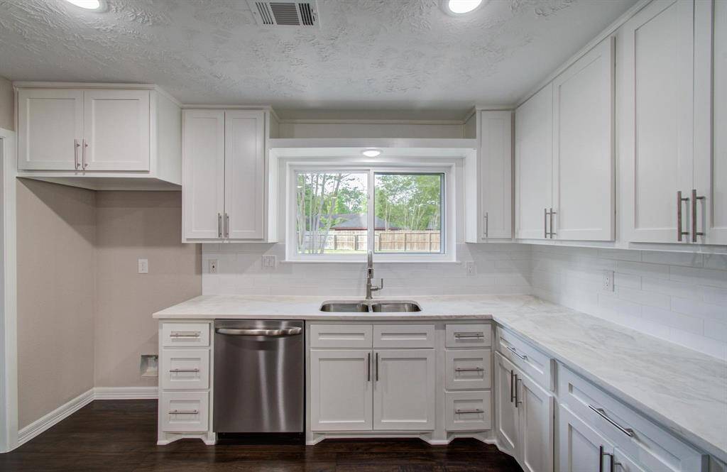 Kitchen also has an undermount sink, new faucet and window overlooking the backyard.