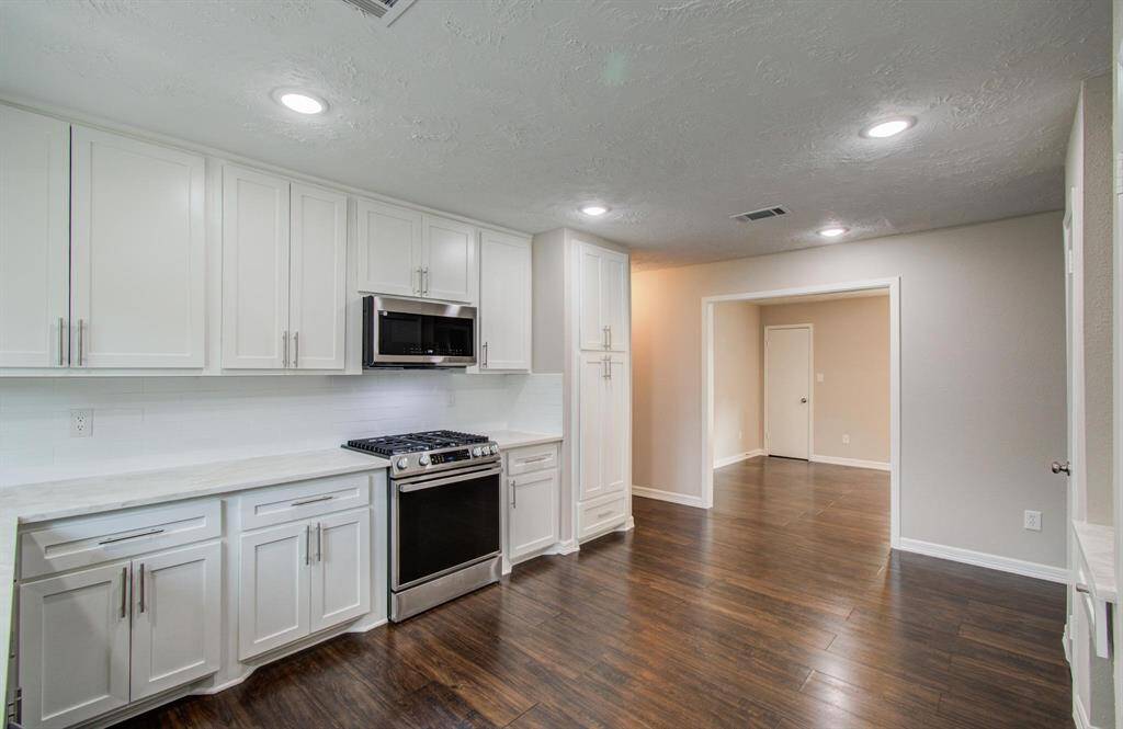 Kitchen opens to the formal dining room for easy access.