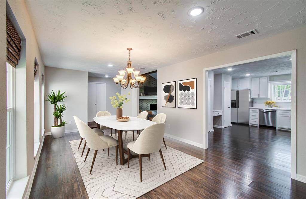 The Large Formal Dining Room off of the kitchen is virtually staged.