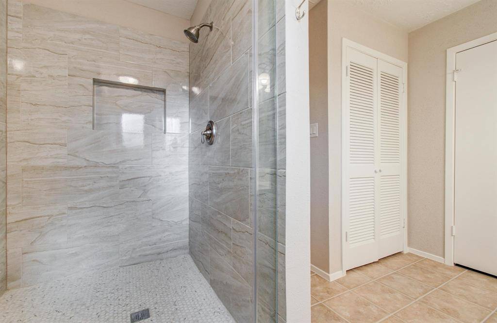 Master Bathroom has also been updated with a large walk in shower featuring new tile.