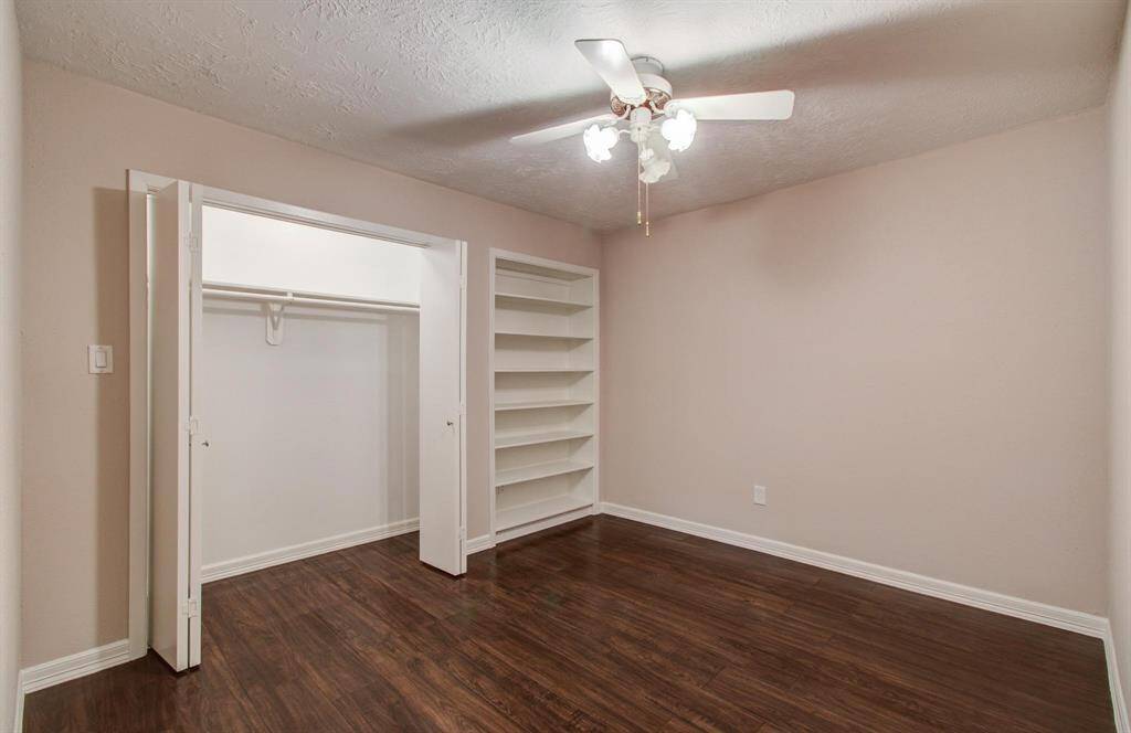 3rd room features a large closet and built in bookcase.