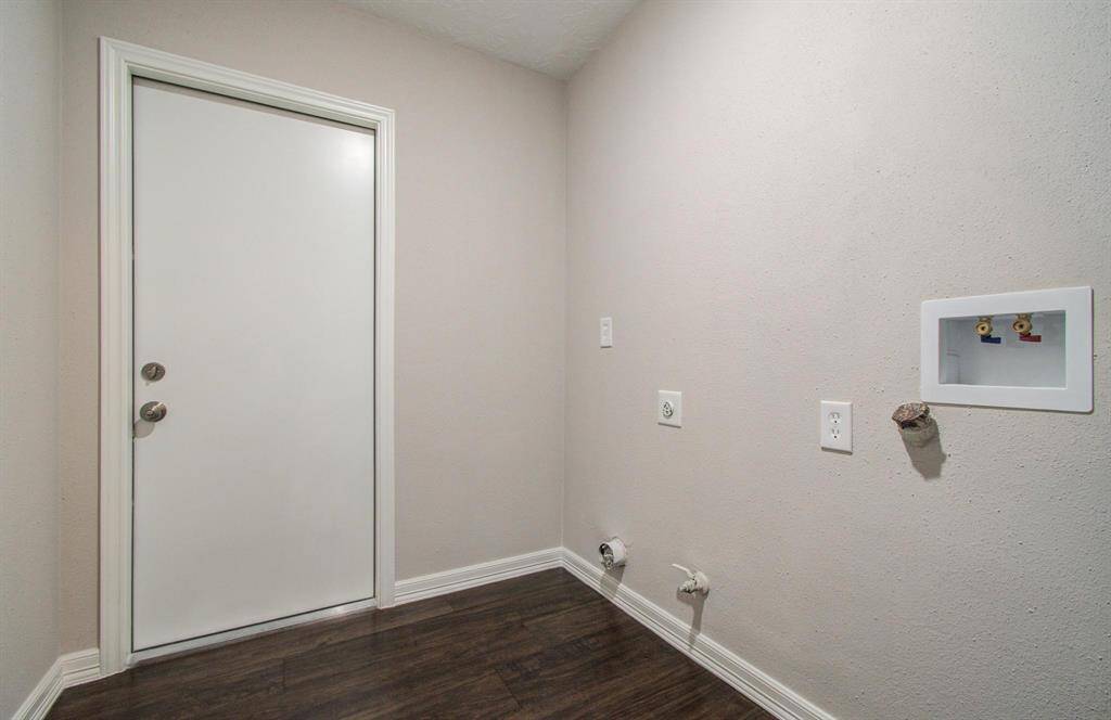 Laundry Room has both gas and electric dryer hook ups.   There is also another washer and dryer hook up in garage.  Garage has also been sheetrocked and painted and has been plumbed out to easily add a water softner.