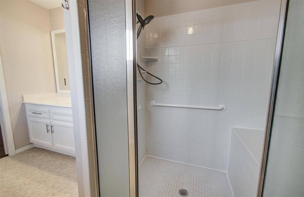 MIL Suite -features a large walk in shower with bench and ADA bar.