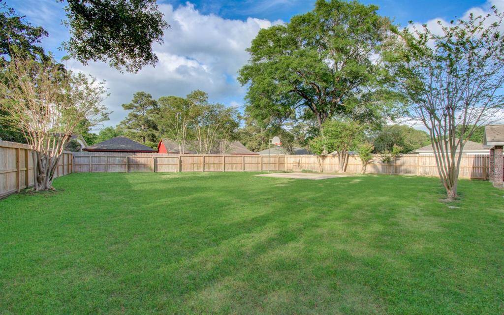 Home features a huge backyard with plenty of green space for kids or dogs to play.   Entire perimeter fence was replaced in 2024.