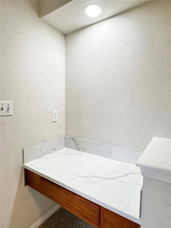 Upgraded quartz vanity area ideal for getting ready in the mornings.