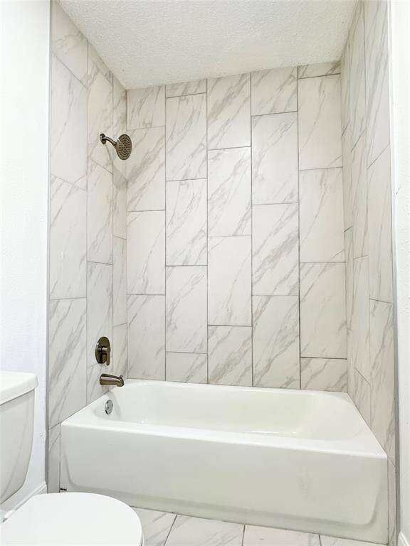 Recently remodeled bathroom with calacata tile and upgraded fixtures.