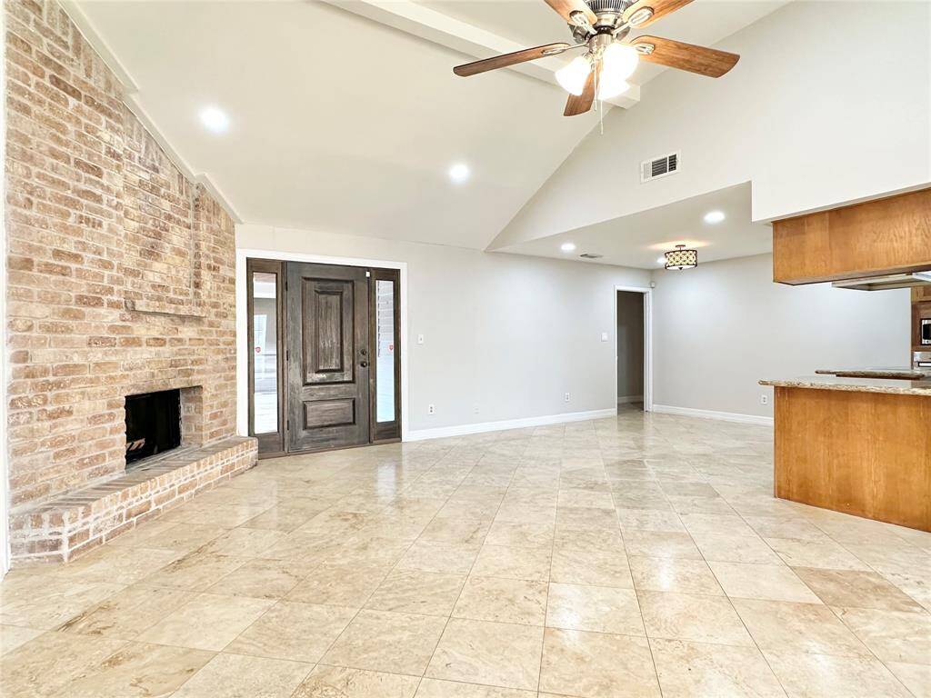 Another view of the living area open to the kitchen/dining areas.
