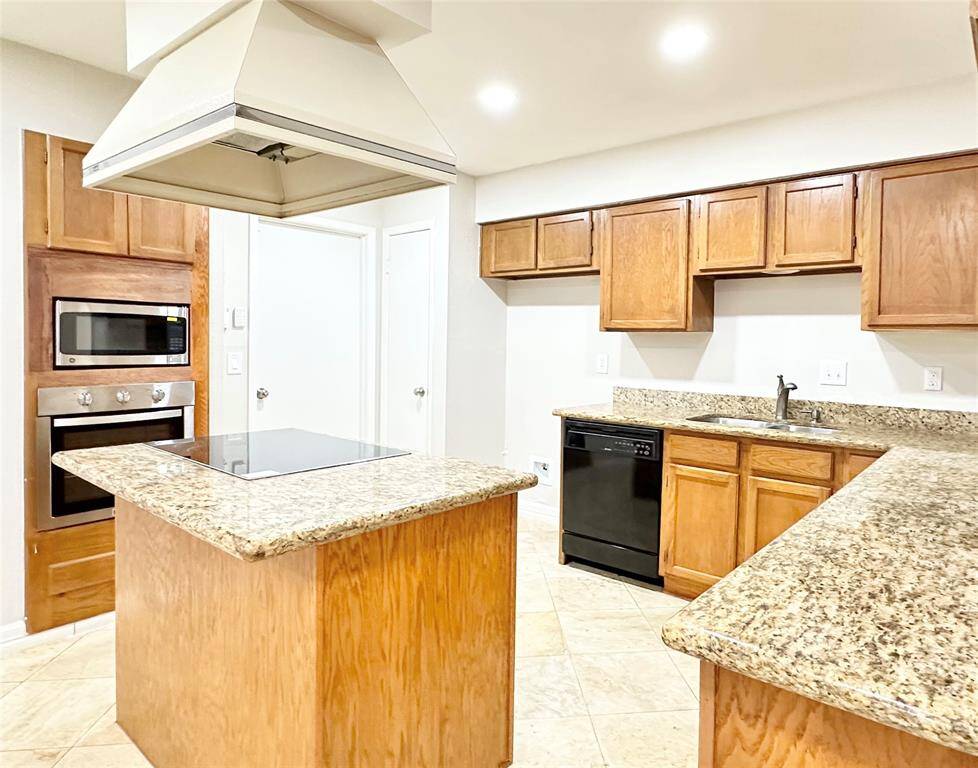 Plenty of cabinets for storage, upgraded granite countertops with tile backsplash and new ss appliances.