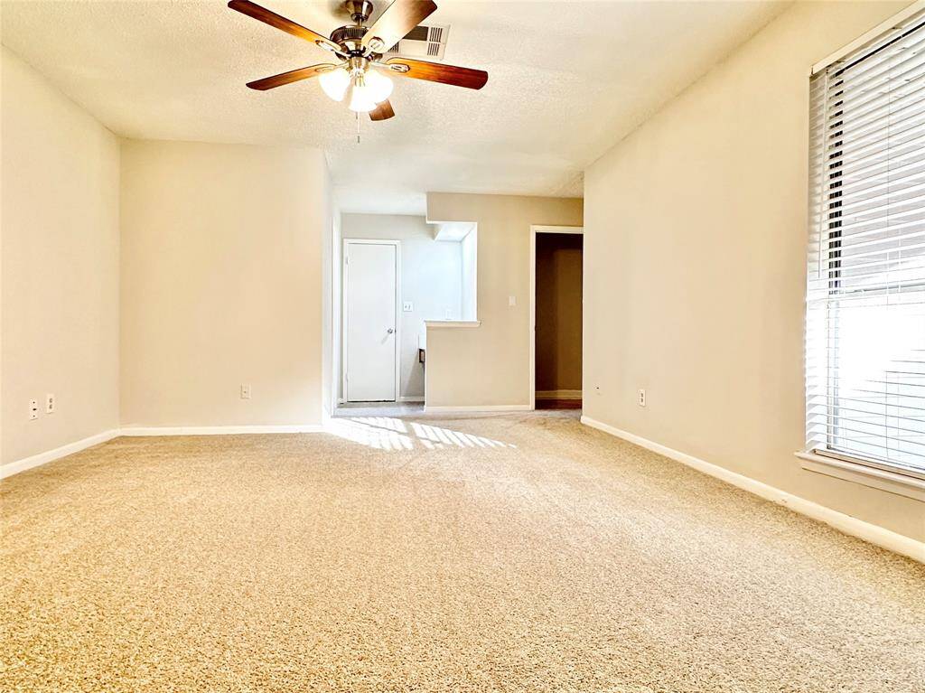 Another view of the primary suite with bonus vanity area.