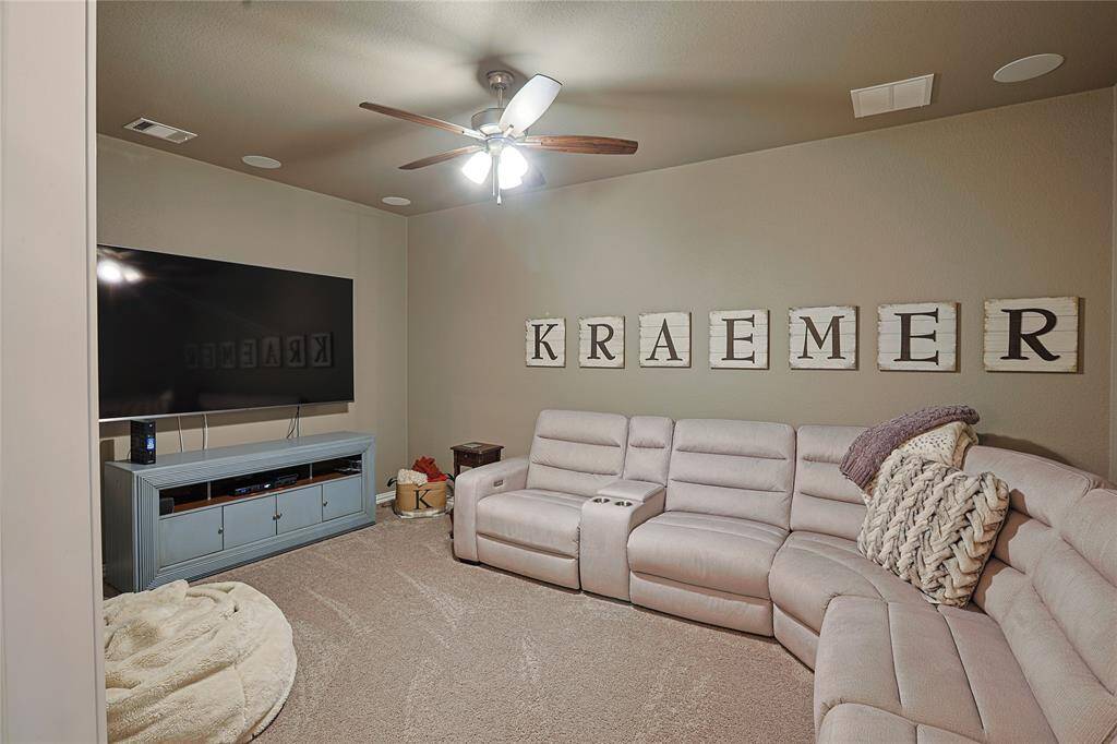 Media room with surround sound and luxury carpet (only media and primary closet have carpet)