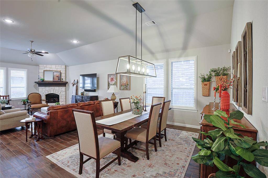 Trendy chandelier highlights the dining space