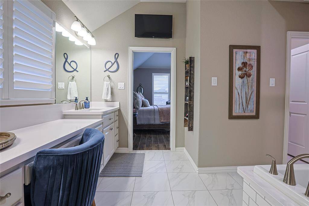 Fabulous tile floor and upgraded countertops with Silestone in the primary ensuite