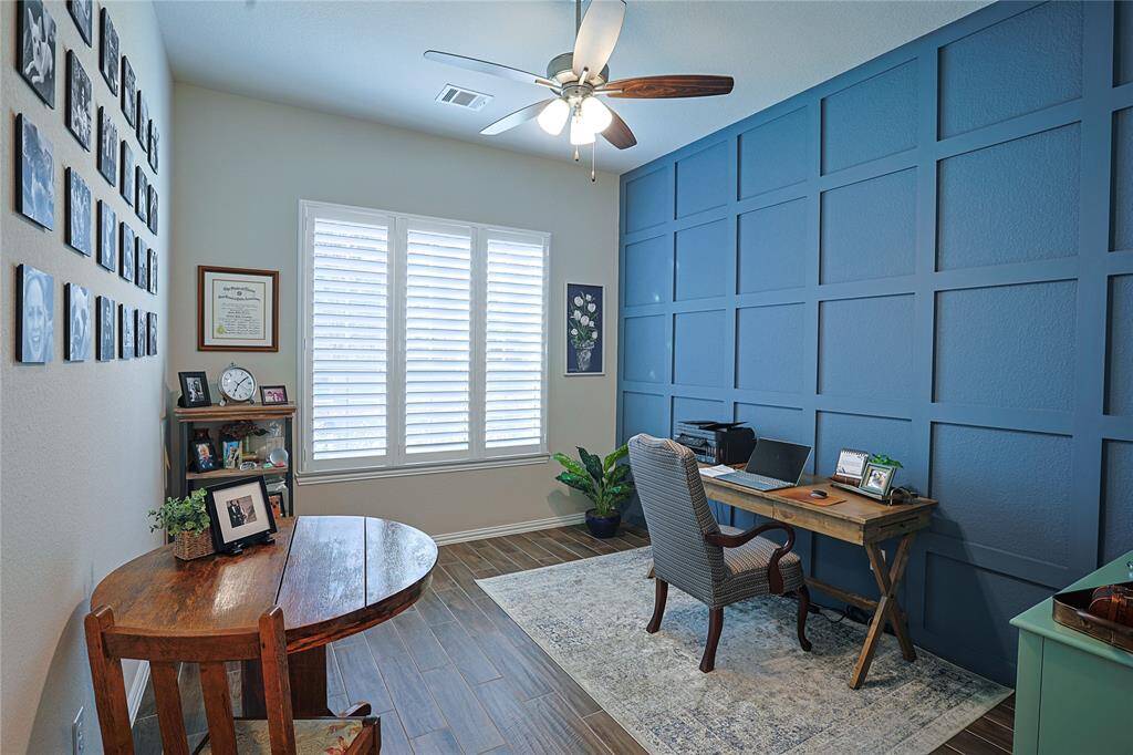 Plantation shutters give you a tranquil view of the front yard
