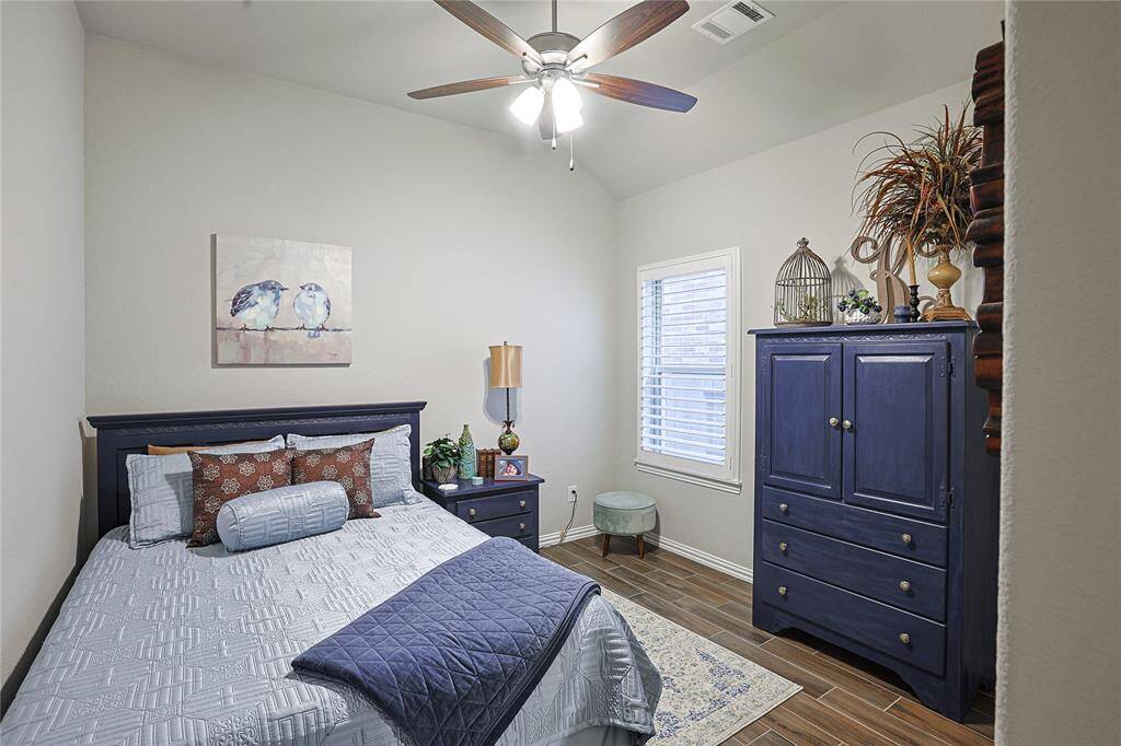 Entire home is painted with Sherwin Williams Agreeable Gray as shown in this secondary bedroom