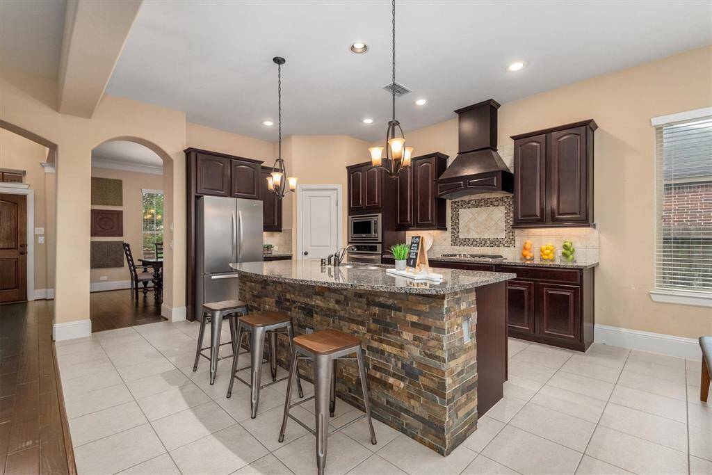 The center island offers the perfect spot for meal prep and casual dining.