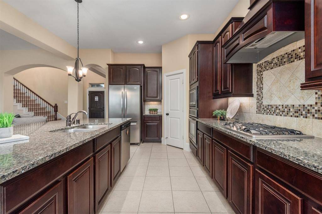 This kitchen design will inspire your inner chef. There's plenty of space in here for more than one to cook and for friends and family to gather.