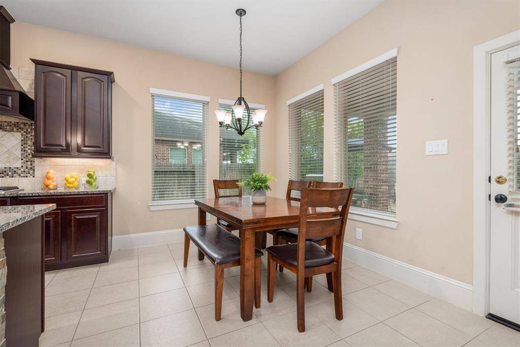 The breakfast room offers a cozy space to enjoy casual meals or relax with family.