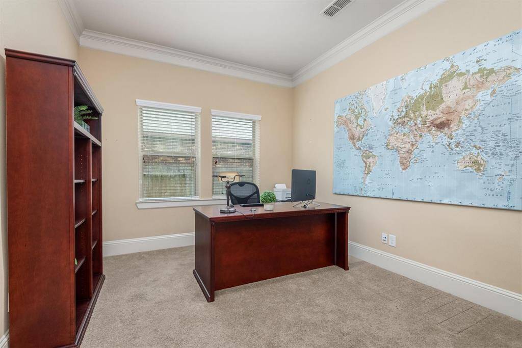 The spacious downstairs home office offers the perfect setting for anyone working from home.  It's conveniently located on the first floor but tucked away from the main living areas.