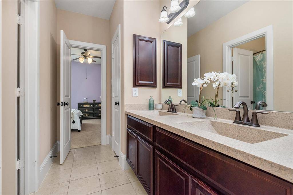 One of 2 upstairs secondary bathrooms.
