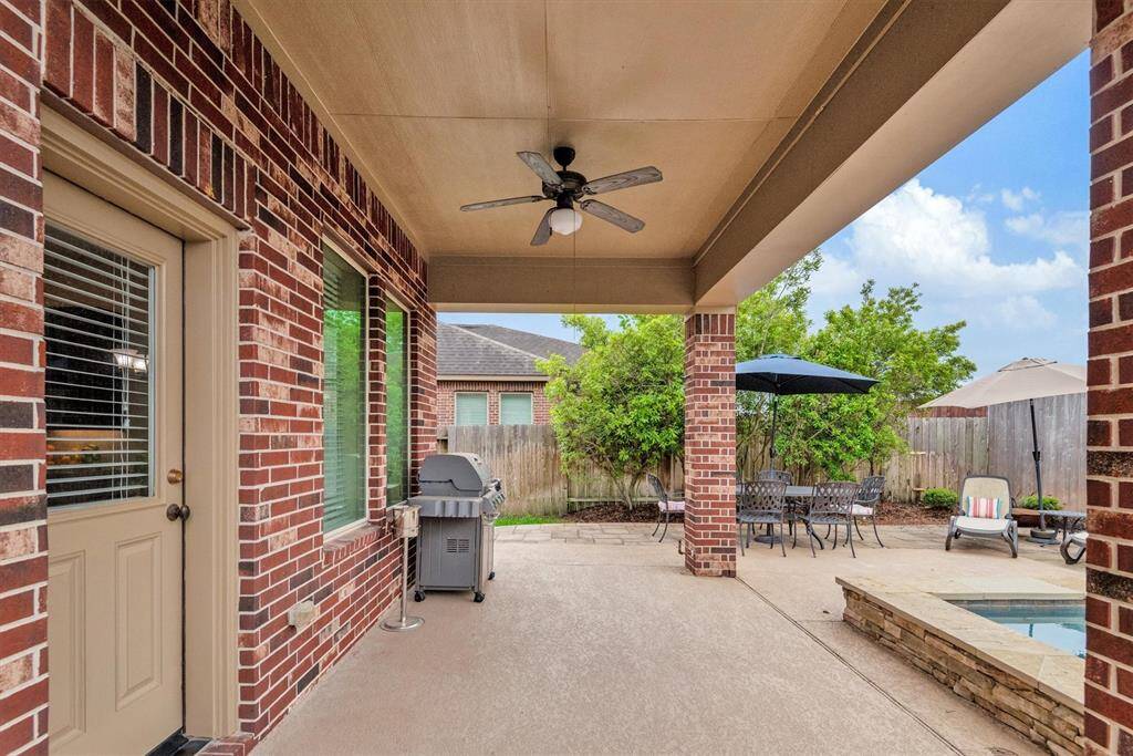 Enjoy the outdoor covered patio space overlooking the pool.  It's perfect for relaxing and entertaining year round.