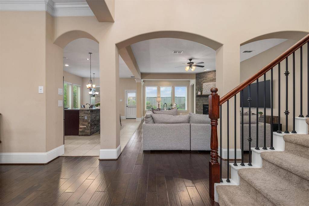 The first step inside the home offers a gorgeous view all the way through the open floor plan to the pool in the back. This is a first impression that will impress!