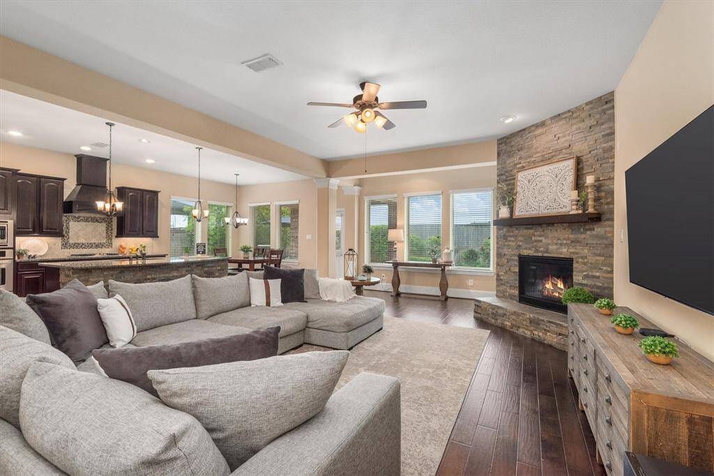The entryway, dining room, kitchen and living room flow seamlessly in this spacious floorplan.