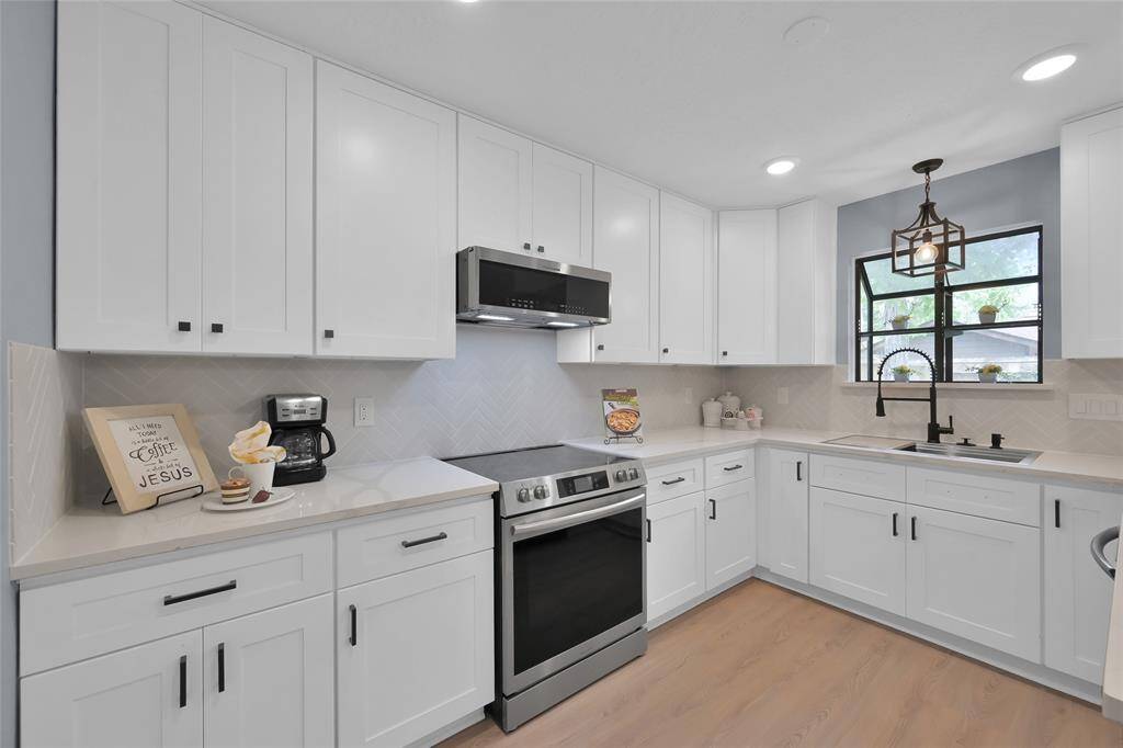 High end appliances and a Herb window.