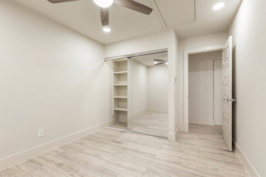The closets offer shelving and sliding mirror doors.