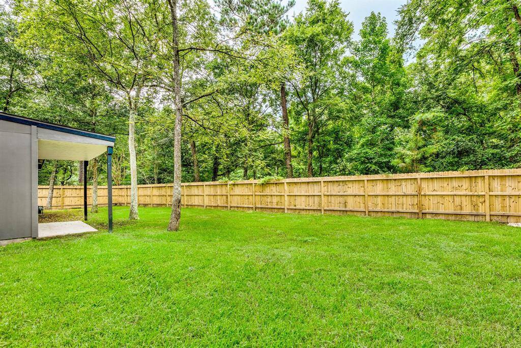 Outside is a lush green space for kids and pets to play.