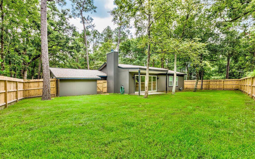 Enjoy the privacy of a new fence and mature trees surrounding the property.