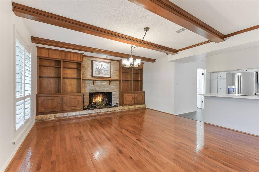 “Refinished hardwood floors bring warmth and elegance to the formal dining space.”