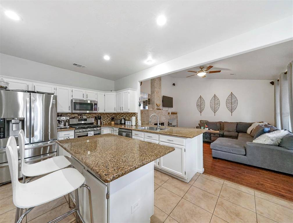 Check out this kitchen! The refrigerator is staying with the home.