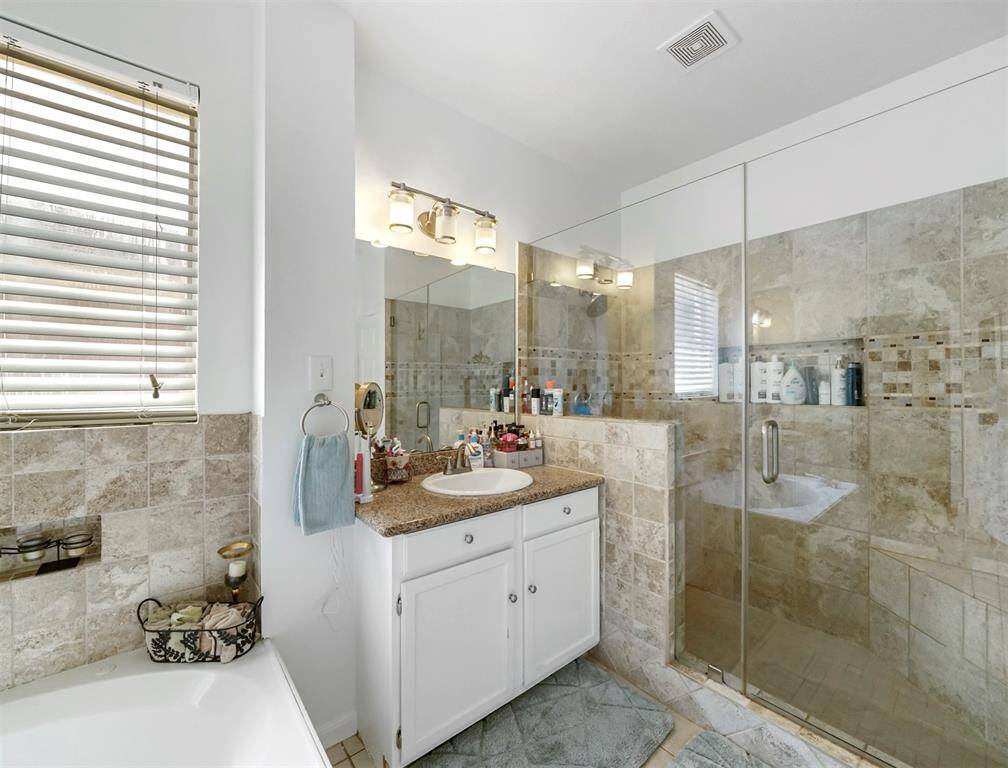 Separate vanities and a huge walk in shower!