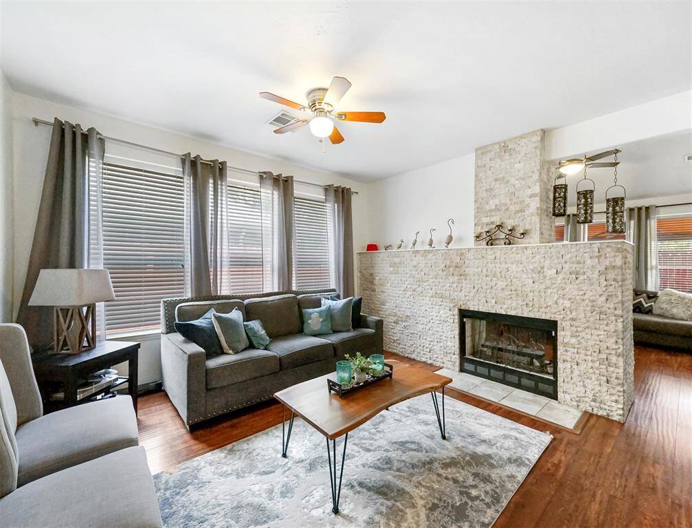 The formal living area and updated fireplace with beautiful stone work.