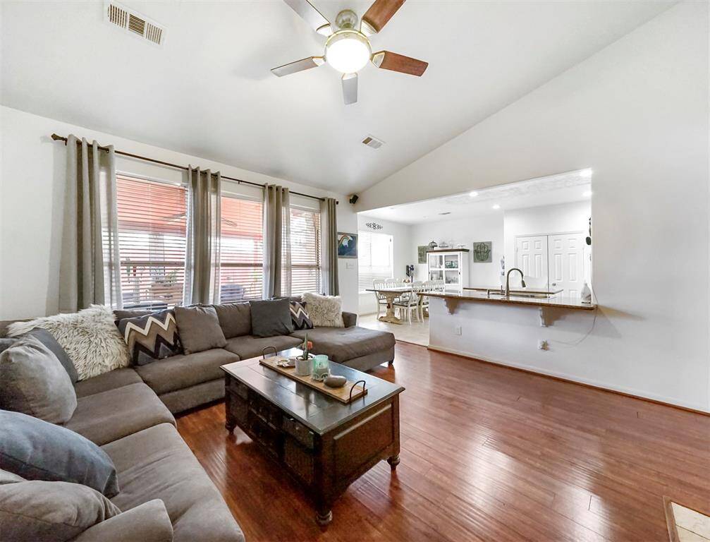 The large windows overlook the outdoor covered patio space.