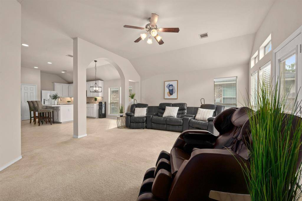 Door from living room opens to the backyard patio.