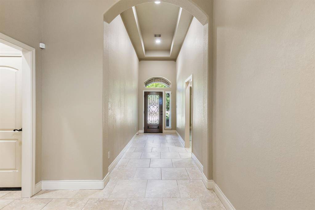 Soaring ceilings are found throughout this exceptional one-story home.