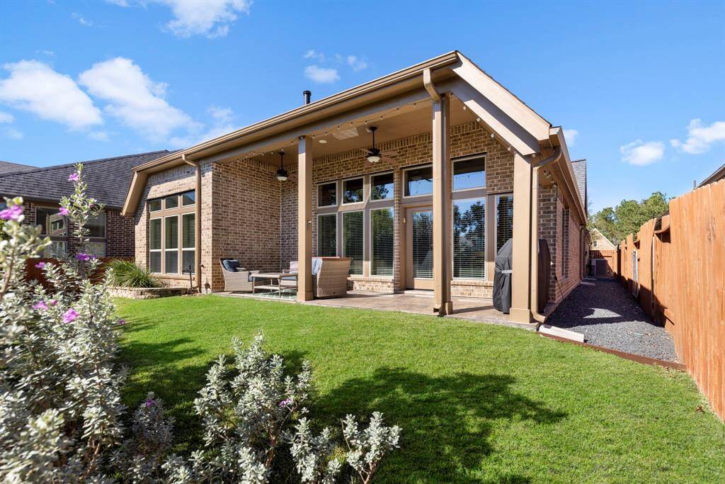 Enjoy the privacy of a spacious backyard featuring a large covered patio—perfect for relaxing or entertaining year-round.