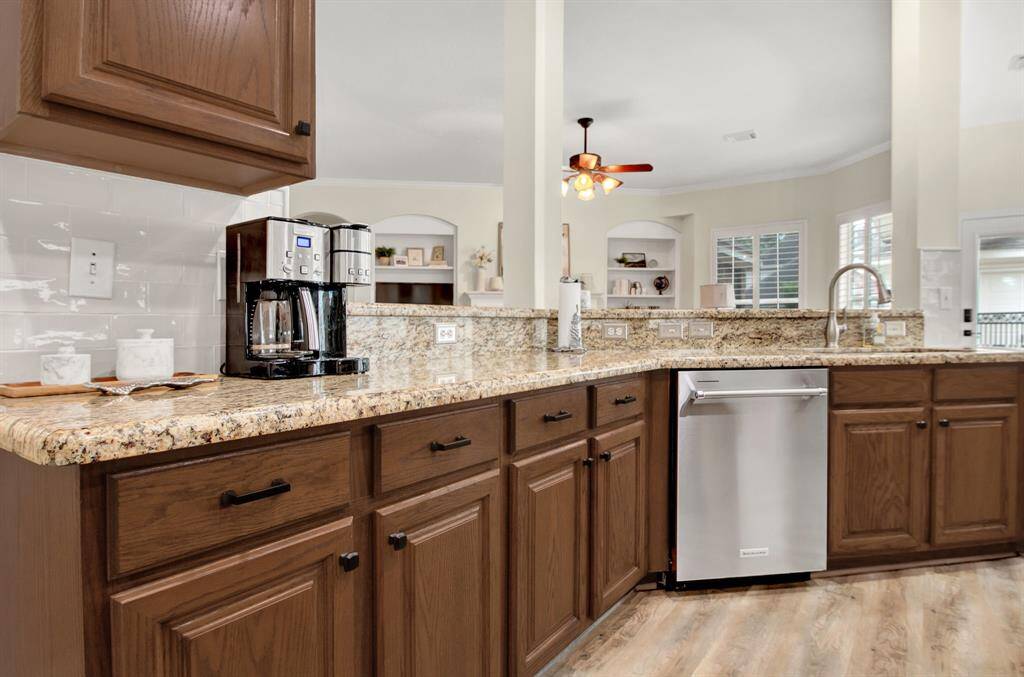 Large kitchen with granite countertops.
