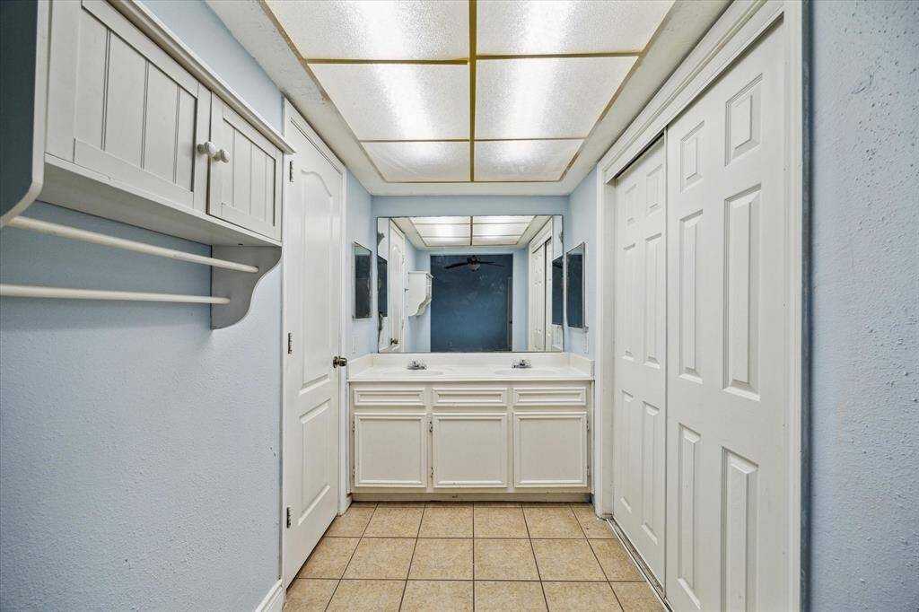 The primary bath has dual sinks and a separate walk in shower.