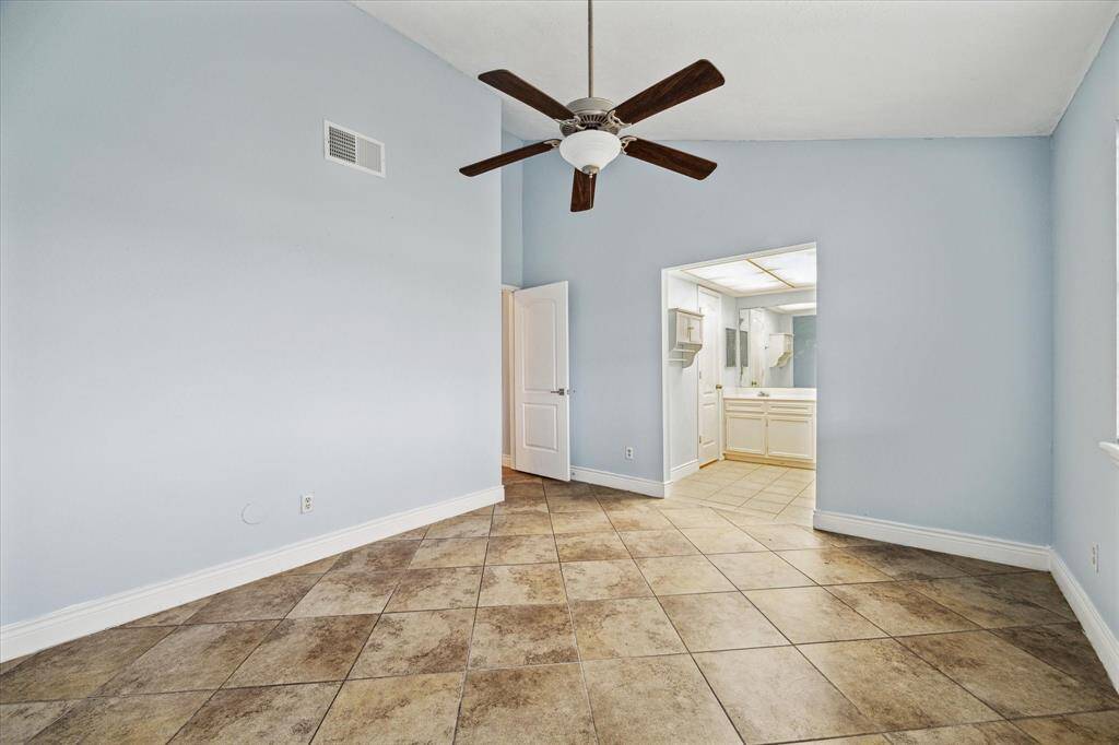 The large primary bedroom has an en suite bathroom.