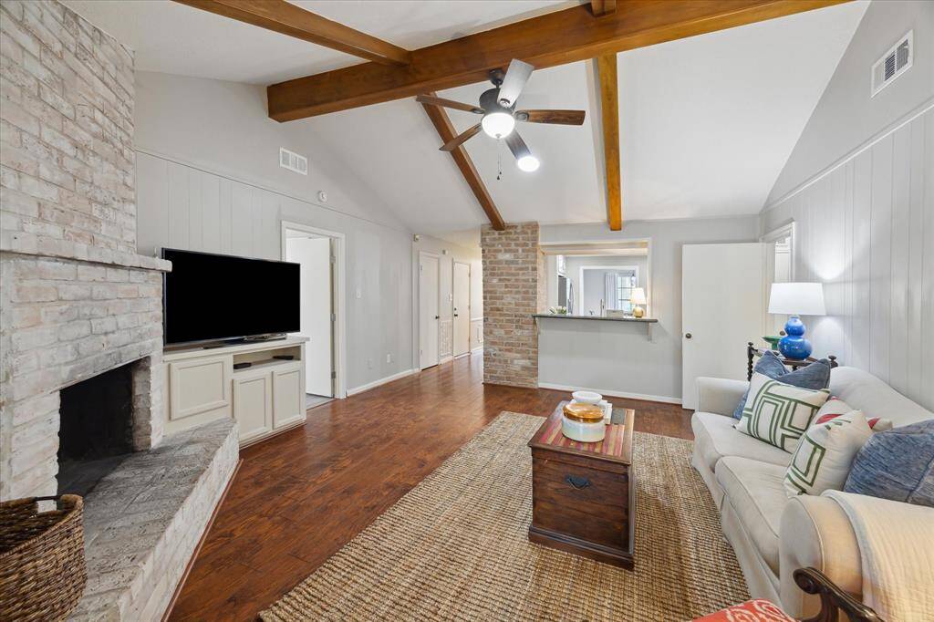 The gas fireplace adds a warm, festive glow, setting the mood for dinner parties.
