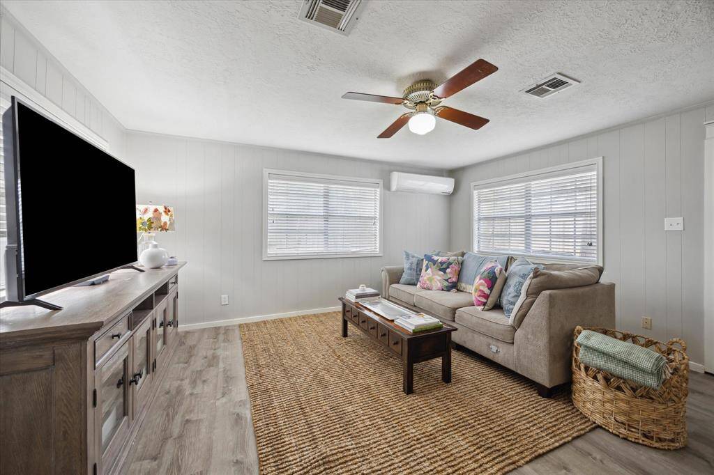 Tucked away for ultimate privacy, the primary bedroom is a serene retreat for rest and relaxation.