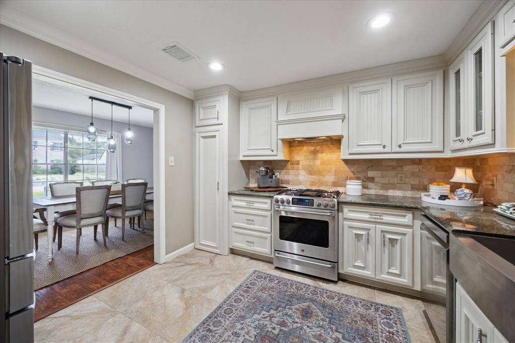 Enjoy each other’s company while preparing dinner in this updated kitchen.