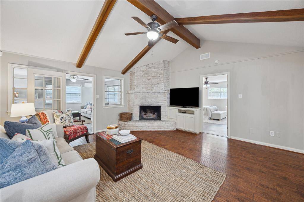 Unwind in the heart of the home—the family room with stunning vaulted ceilings.