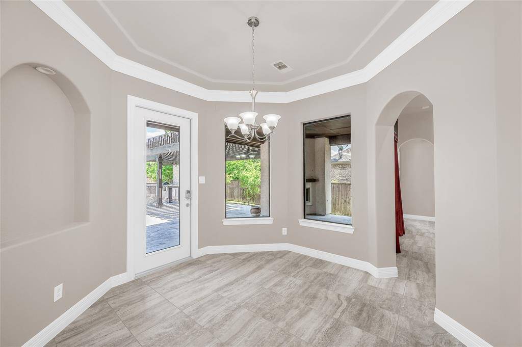 Charming breakfast room with direct access to the covered back patio.