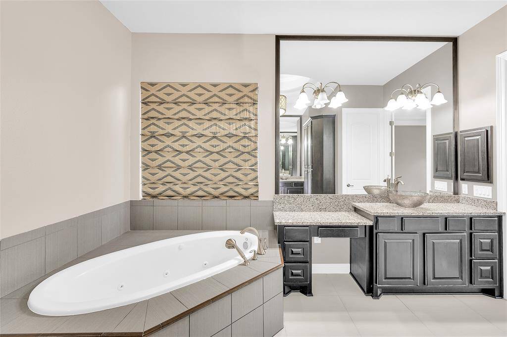 Ensuite bathroom with large soaker tub.